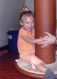 Child Balancing On Swing